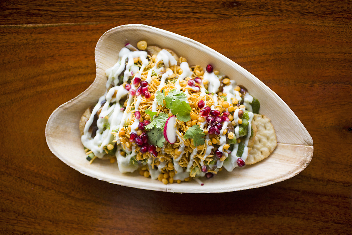 Wooden bowl filled with Indian Cuisine