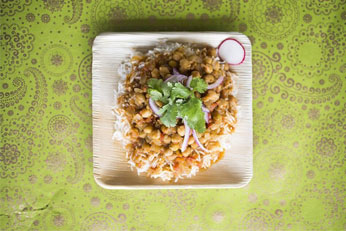 wooden bowl filled with rice and sauce